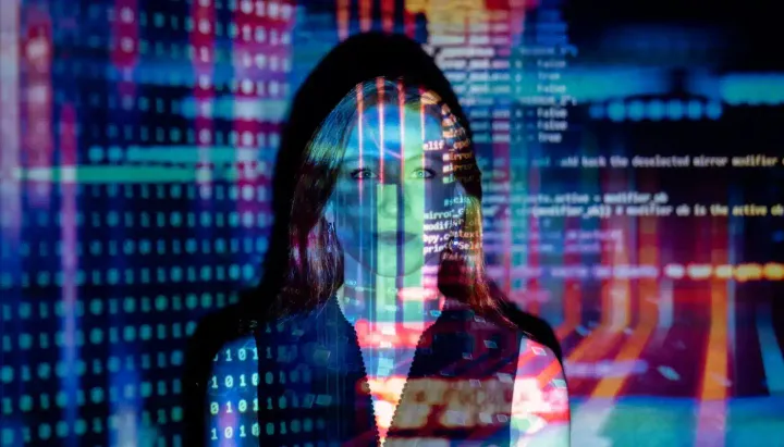 A happy woman within a technological background